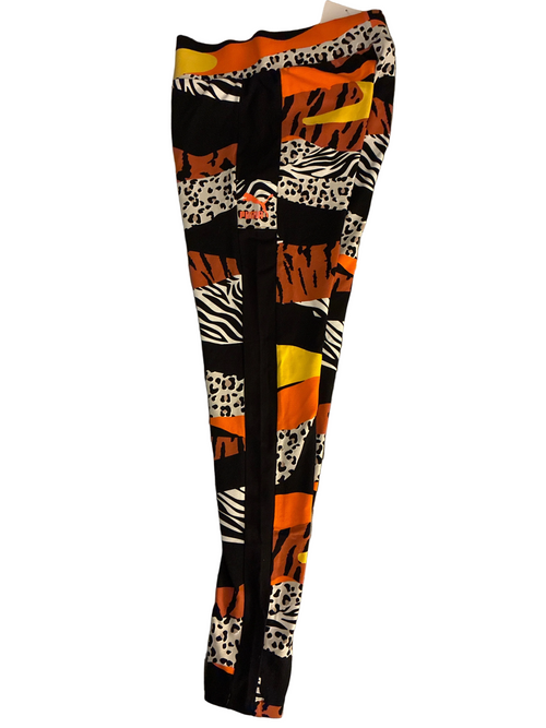 Colorful patterned leggings on a striped fabric background